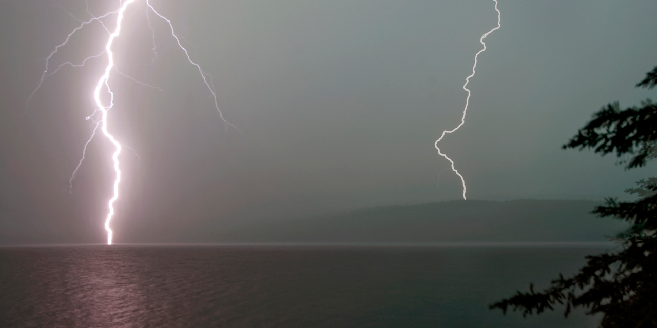 lightning strikes over lake of two rivers algonquin tour