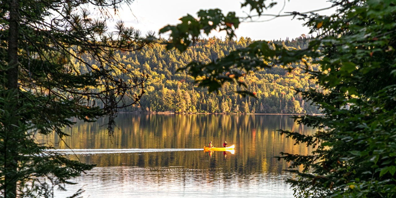 fall canoeing at sunset lake of two rivers algonquin park