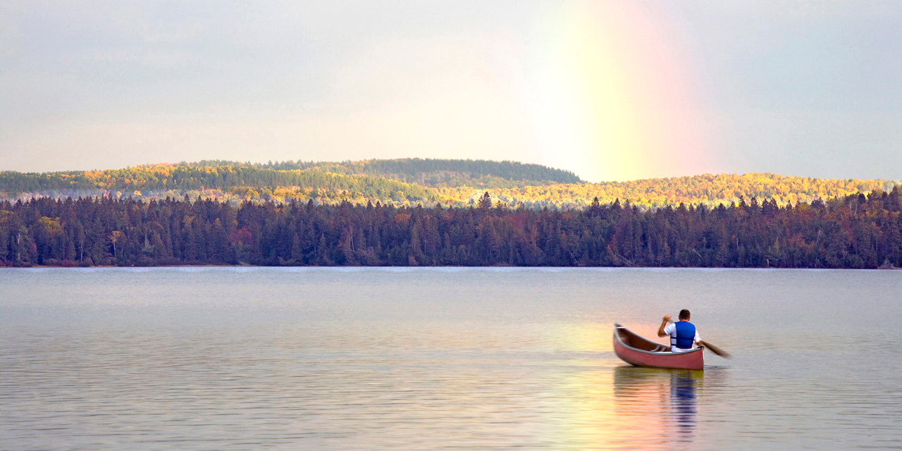canoeing under the rainbow on lake of two rivers ontario