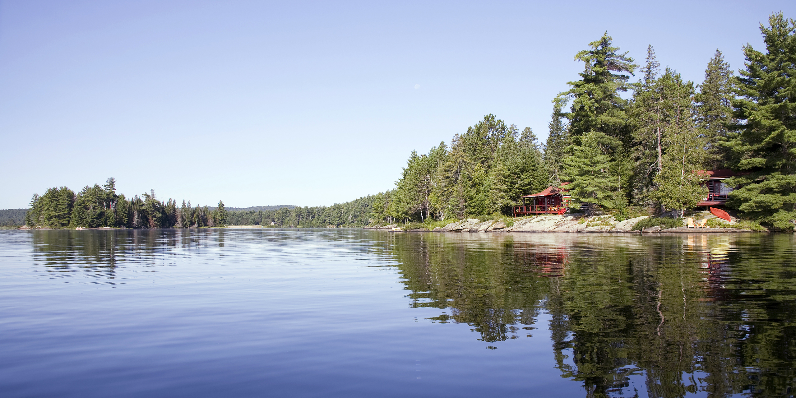 panoramic view of algonquin property from lake with cabins